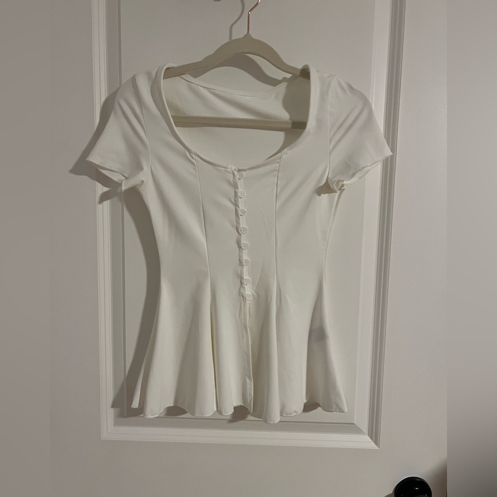 Elegant White  short-sleeved peplum top.